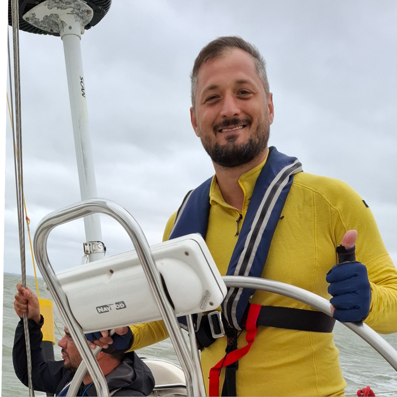 Ivan from Yachtaris at the helm of a sailing yacht
